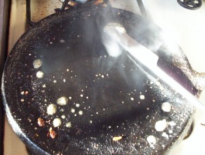 After the toasting but before the egg frying, turn down the fire and melt a pat of cheap margarine on your griddle.