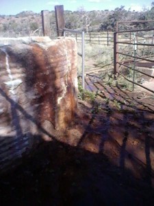 The phone camera probably didn't capture this at all, but water is pouring from all those vertical cracks in the cistern.